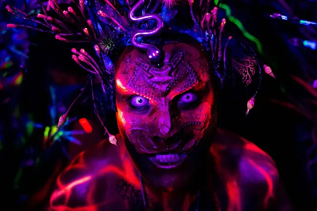 Performer with fluorescent make-up at Adobe's Mothership party