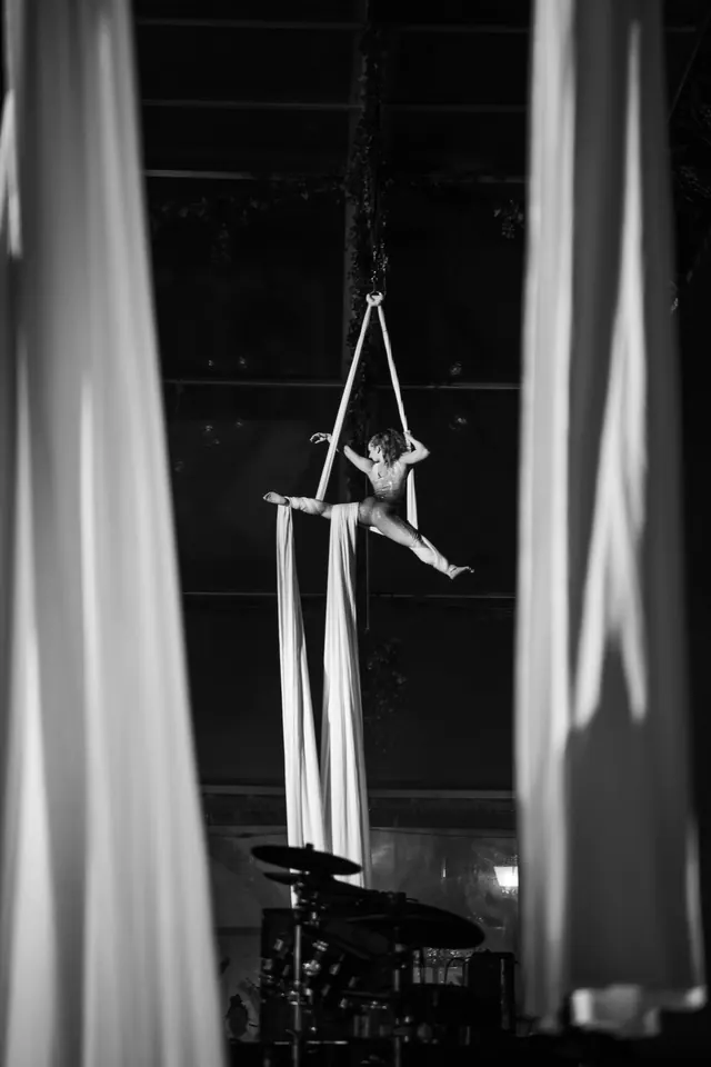 Black and white aerial acrobat at the Logitech and Microsoft event