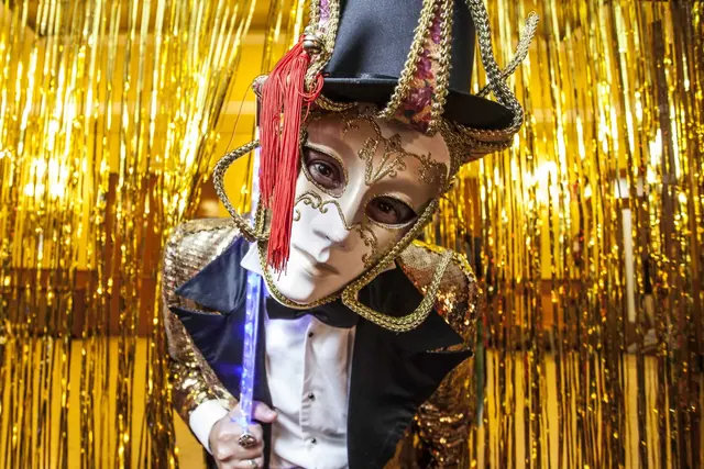 Performer in a golden mask at Intel's Cabaret Cirque party