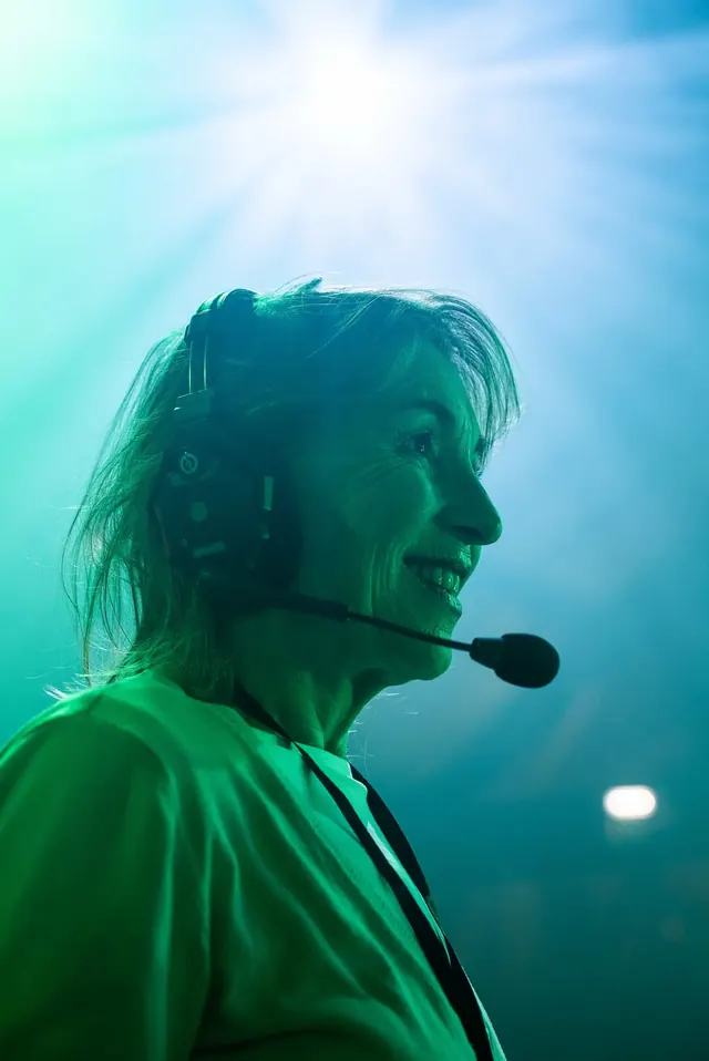 Stage manager with headset cueing on stage