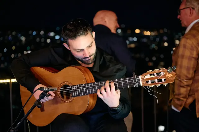 Guitarist playing at the Logitech event